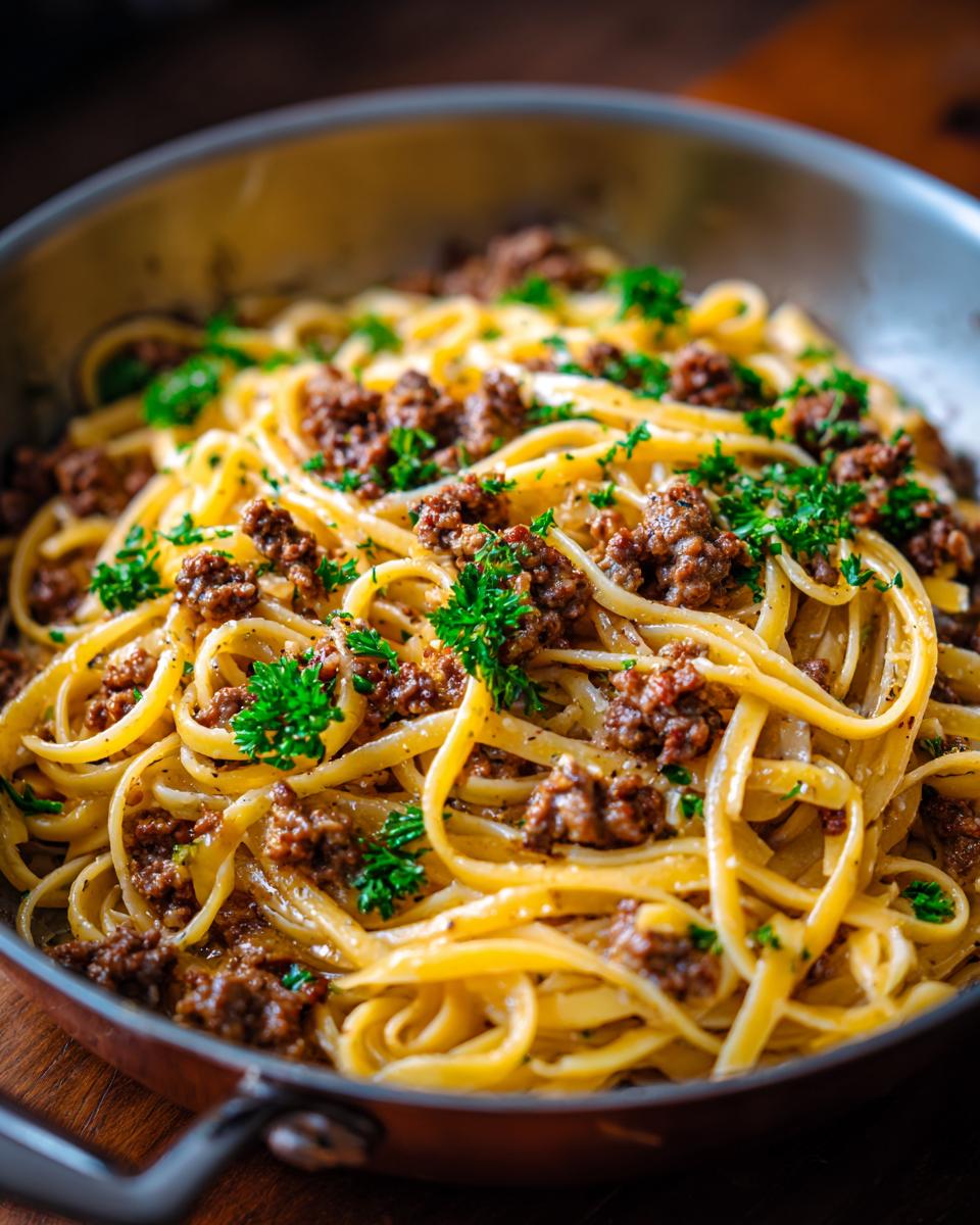 Close-up of delicious Beef and Garlic Butter Linguine served in a pan, garnished with fresh parsley.