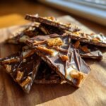 Close-up of chocolate pretzel bark with chunks of pretzels and nuts, a sweet and salty tamale pie casserole alternative.