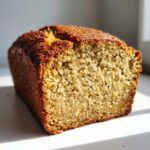 Close-up of a freshly baked banana cottage cheese bread loaf showing its moist, dense crumb texture.