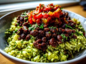 Close-up of a flavorful black bean and rice bowl featuring cilantro-lime rice, seasoned black beans, and salsa topping.